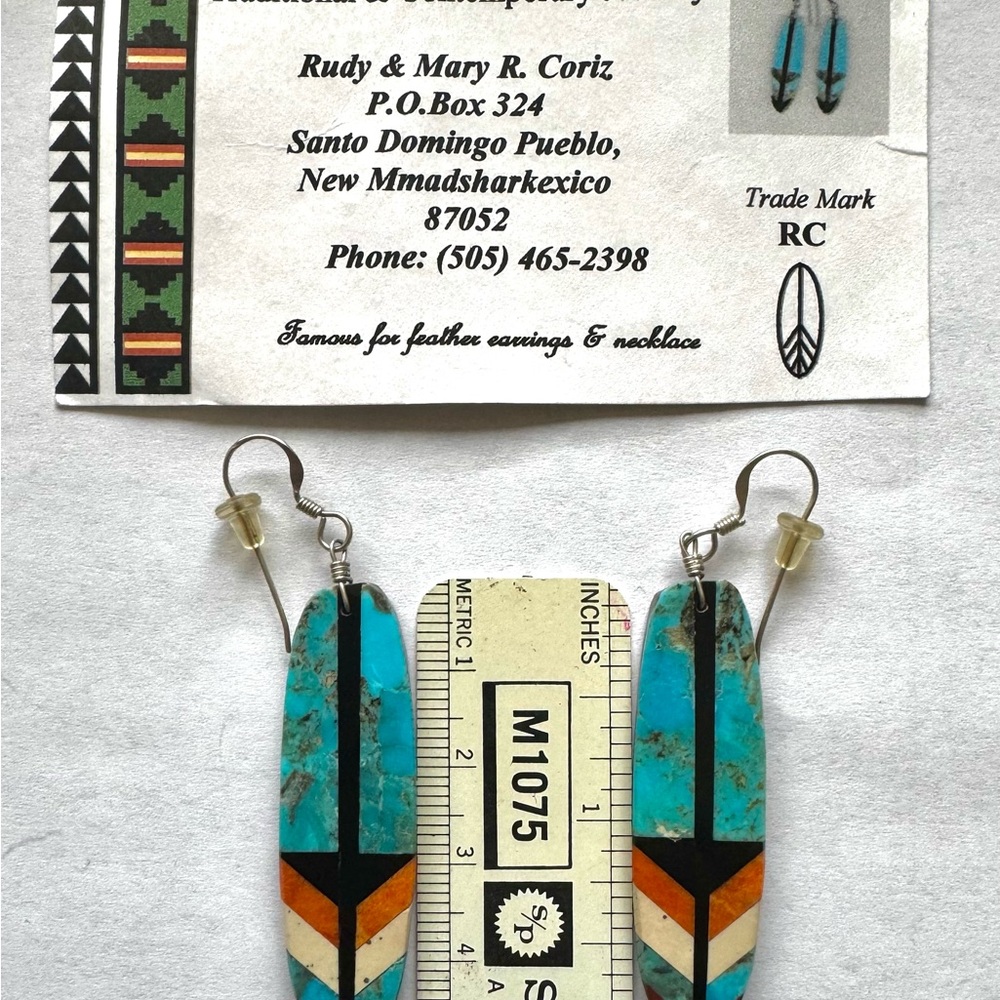 Feather earrings designed by artist from Santo Domingo Pueblo.